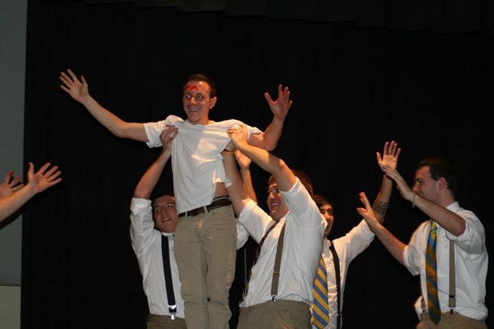 New+members+of+Sigma+Chi+hoist+New+Member+Educator+Evan+Anthony+as+part+of+their+Airband+performance.