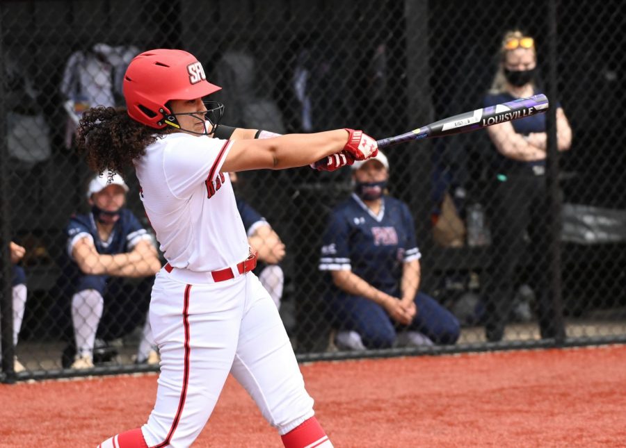 Rousseau Helps Power Softball Squad to First Place in NEC