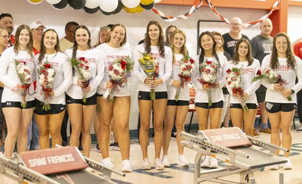 Swim Team Posts Home Win, Honors Seniors