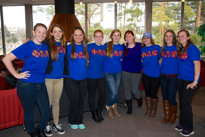Phi Lamda Psi sisters pose together at their Spaghetti Dinner.