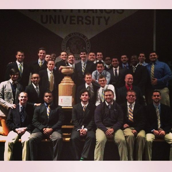 Sigma Chi poses with the Greek Week trophy at the closing ceremony.