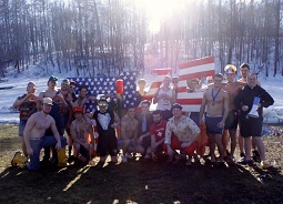 TKE brothers pose after plunging into Lake Saint Francis to raise money for their philanthropy.